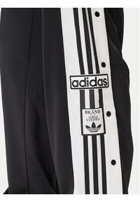 Adidas - adidas Spodnie dresowe Adibreak JP3760 Czarny Regular Fit. Kolor: czarny. Materiał: syntetyk