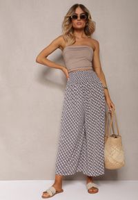 Renee - Czarno-Beżowe Spodnie High Waist z Bawełny z Rozszerzanymi Nogawkami i Gumką Nereialla. Stan: podwyższony. Kolor: czarny. Materiał: bawełna. Wzór: aplikacja