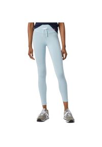 Spodnie New Balance WP21556MGF - niebieskie. Kolor: niebieski. Materiał: bawełna, poliester