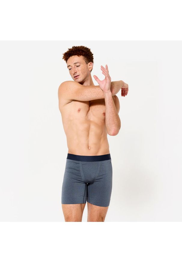 Decathlon - Bokserki męskie długie. Kolor: niebieski. Materiał: materiał, skóra, elastan. Długość: długie. Sport: fitness