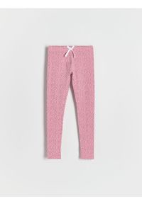 Reserved - Wzorzyste legginsy z kokardką - różowy. Kolor: różowy. Materiał: bawełna #1