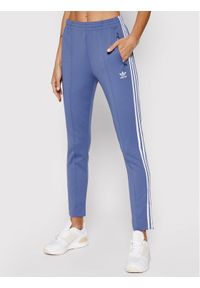 Adidas - adidas Spodnie dresowe Primeblue Sst Track GN2942 Niebieski Slim Fit. Kolor: niebieski. Materiał: dresówka #1