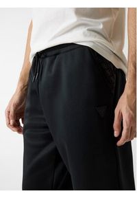 Guess Spodnie materiałowe 180799 Czarny Regular Fit. Kolor: czarny. Materiał: materiał #4