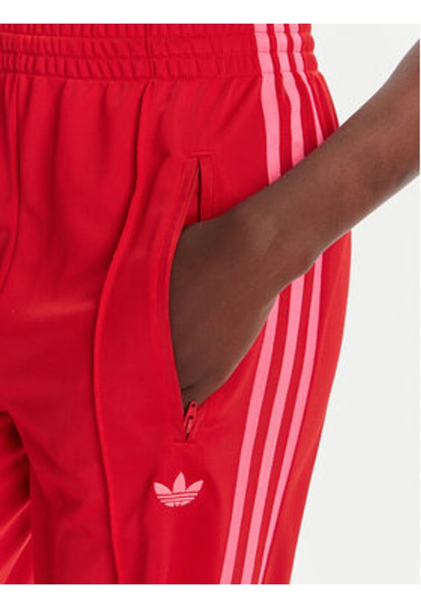 Adidas - adidas Spodnie dresowe adicolor Classic Firebird JW1225 Czerwony Loose Fit. Kolor: czerwony. Materiał: syntetyk