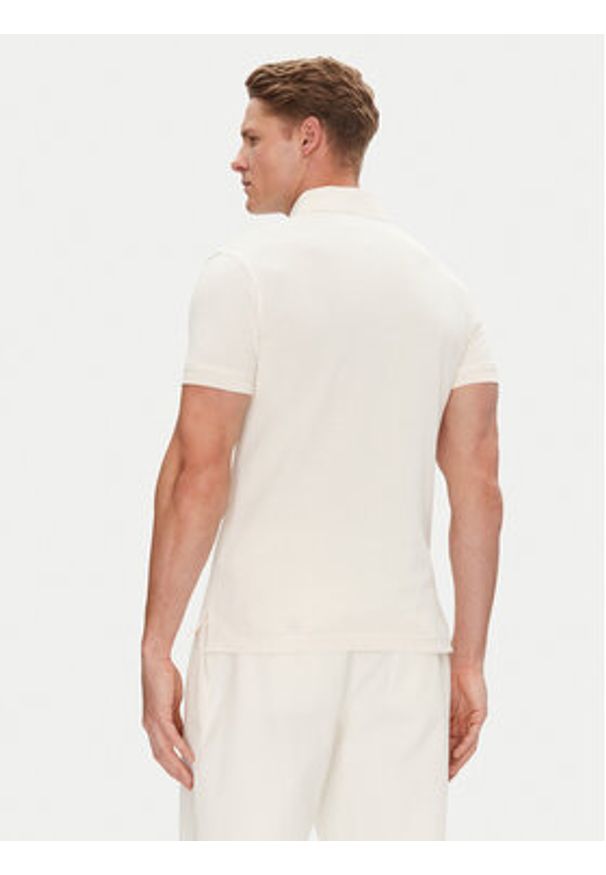 TOMMY HILFIGER - Tommy Hilfiger Polo 1985 MW0MW17771 Beżowy Slim Fit. Typ kołnierza: polo. Kolor: beżowy. Materiał: bawełna