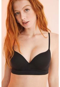 Women Secret - women'secret biustonosz SEAMLESS 3 kolor czarny gładki 5105022. Kolor: czarny. Wzór: gładki #1