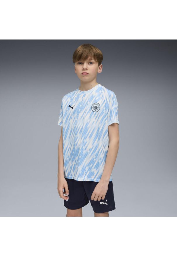 Puma - Młodzieżowa koszulka przedmeczowa Manchester City PUMA Silver Sky Blue. Kolor: niebieski. Sport: piłka nożna