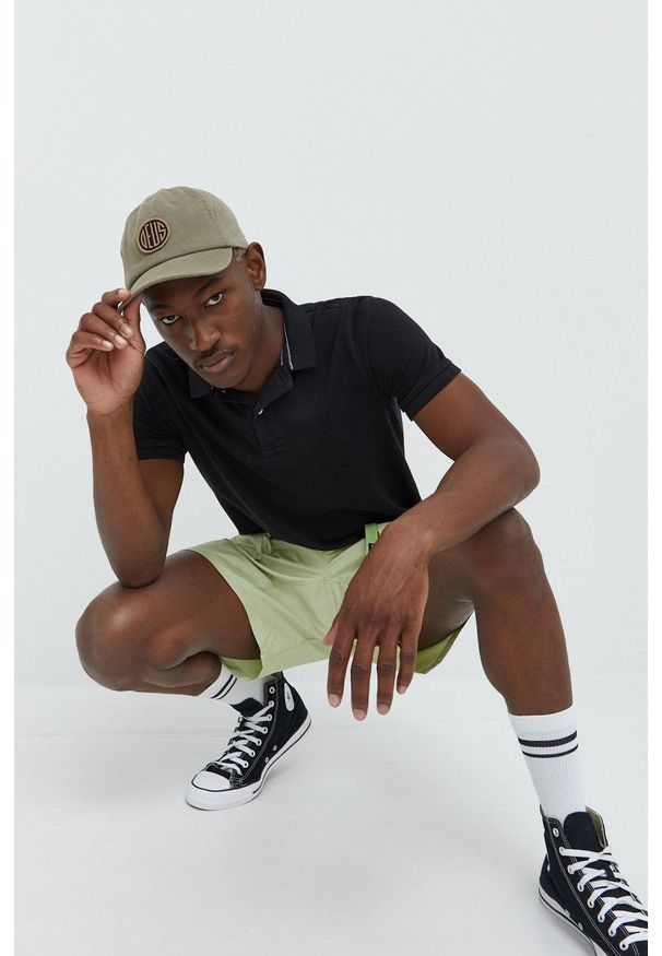 Superdry polo bawełniane kolor czarny gładki. Typ kołnierza: polo. Kolor: czarny. Materiał: bawełna. Długość: krótkie. Wzór: gładki