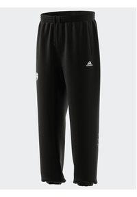 Adidas - adidas Spodnie dresowe HY1288 Czarny Loose Fit. Kolor: czarny. Materiał: dresówka, bawełna #5