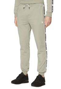 Guess - GUESS Zielone męskie spodnie dresowe z lampasami New Arlo, Rozmiar XL. Kolor: zielony. Materiał: dresówka #2