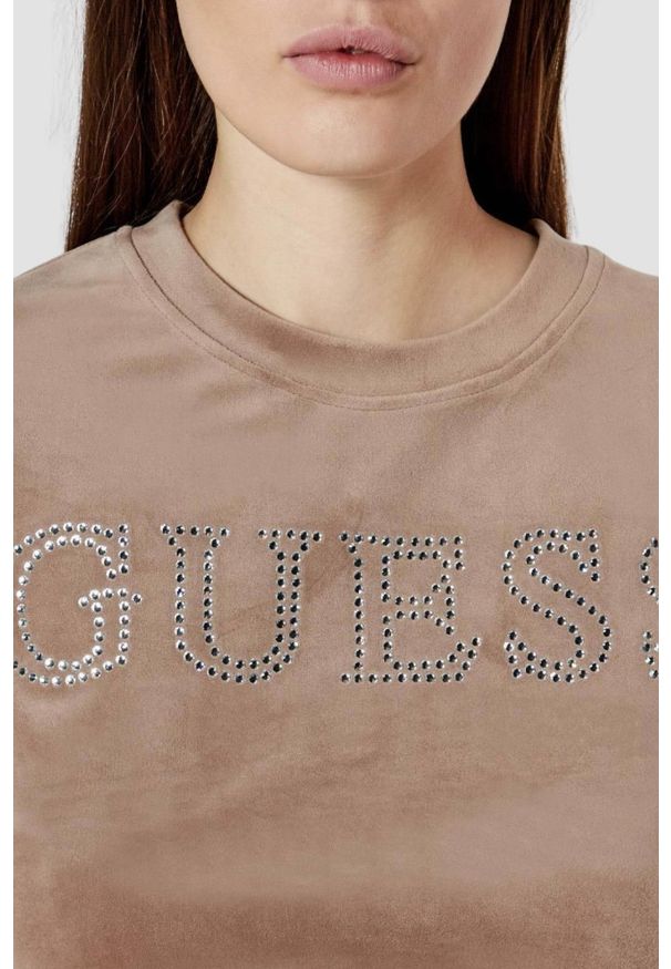 Guess - GUESS Brązowy damski top Couture Tee. Kolor: brązowy