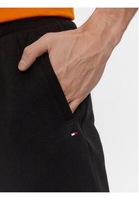TOMMY HILFIGER - Tommy Hilfiger Spodnie dresowe Flag Logo MW0MW36142 Czarny Relaxed Fit. Kolor: czarny. Materiał: bawełna