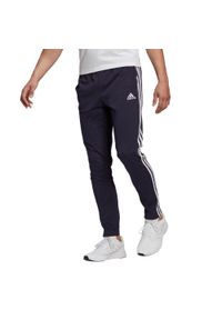 Adidas - Spodnie Essentials Single Jersey Tapered Open Hem 3-Stripes Rozmiar S Niebieski…. Kolor: niebieski. Materiał: jersey. Wzór: paski