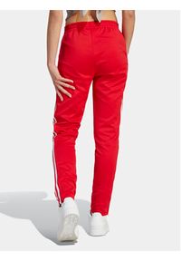 Adidas - adidas Spodnie dresowe adicolor SST IK6603 Czerwony Slim Fit. Kolor: czerwony. Materiał: bawełna #3