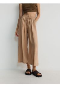 Reserved - Spodnie culotte z modalu - brzoskwiniowy. Kolor: pomarańczowy
