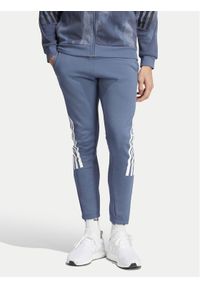 Adidas - adidas Spodnie dresowe Future Icons 3-Stripes IR9194 Niebieski Slim Fit. Kolor: niebieski. Materiał: bawełna, syntetyk