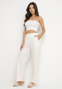 Born2be - Jasnobeżowe Spodnie z Gumką w Pasie i Szeroką Nogawką Mironia. Okazja: na co dzień. Kolor: beżowy. Styl: elegancki, casual #4
