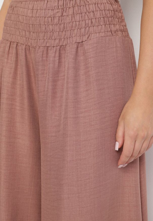 Born2be - Brązowe Spodnie o Szerokim Kroju z Wysokim Stanem i Elastyczną Talią Ralbia. Okazja: na co dzień. Stan: podwyższony. Kolor: brązowy. Styl: elegancki, klasyczny, casual