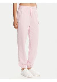 Under Armour Spodnie dresowe Ua Rival 1382735 Różowy Loose Fit. Kolor: różowy. Materiał: bawełna