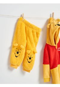 Sinsay - Spodnie Winnie the Pooh - żółty. Kolor: żółty