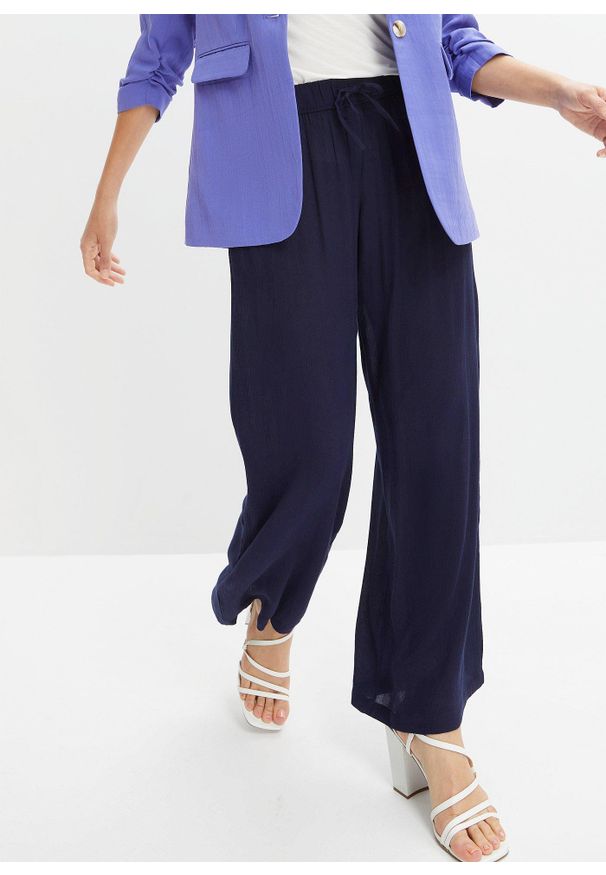 bonprix - Spodnie Marlena z lejącej wiskozy. Kolor: niebieski. Materiał: wiskoza