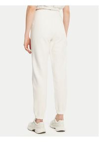 Tommy Jeans Spodnie dresowe Badge DW0DW20679 Écru Regular Fit. Materiał: bawełna