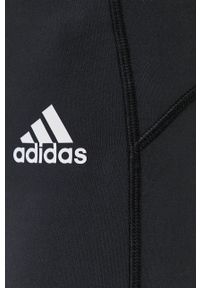 Adidas - adidas Legginsy damskie kolor czarny z nadrukiem. Kolor: czarny. Materiał: materiał, dzianina. Wzór: nadruk