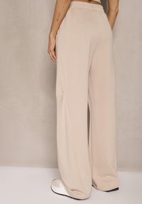 Renee - Beżowe Spodnie o Szerokim Kroju High Waist z Gumką w Pasie Belobira. Okazja: na co dzień. Stan: podwyższony. Kolor: beżowy. Długość: długie. Styl: casual, elegancki, wizytowy