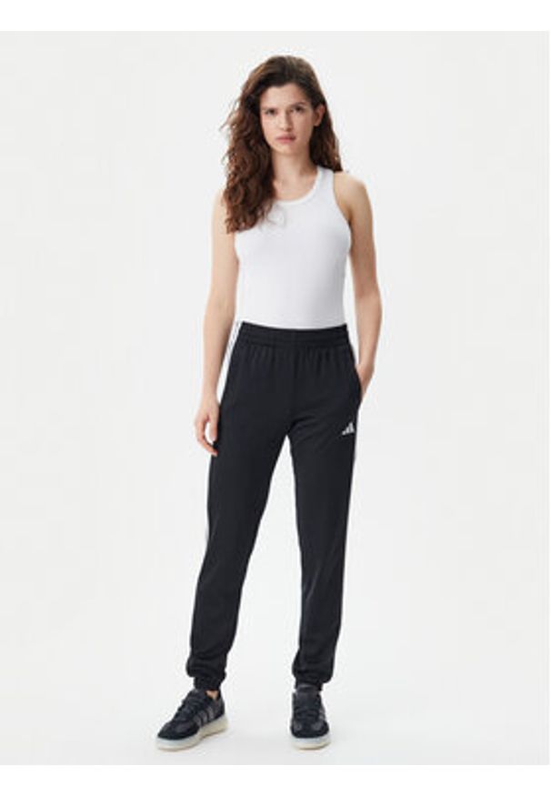 Adidas - adidas Spodnie dresowe Tricot 3-Stripes JF3383 Czarny Regular Fit. Kolor: czarny. Materiał: syntetyk