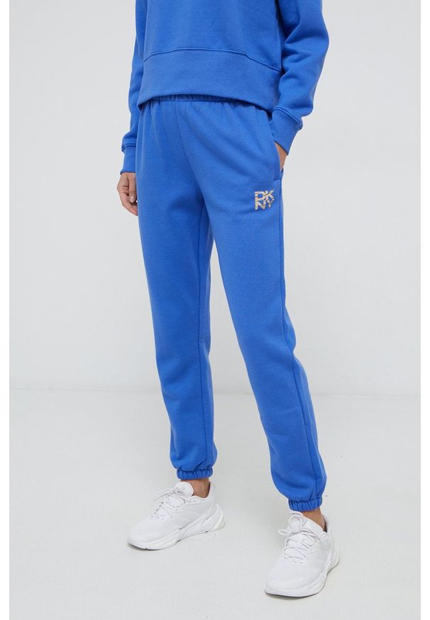 DKNY - Dkny - Spodnie. Kolor: niebieski. Wzór: nadruk