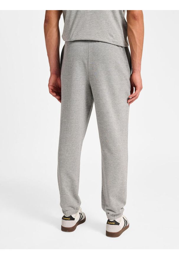 Spodnie do biegania Hummel Pulse. Kolor: szary. Materiał: dresówka. Sport: fitness