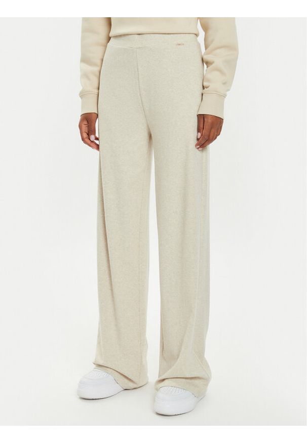 Guess Spodnie dzianinowe O4BB02 KCHZ2 Beżowy Relaxed Fit. Kolor: beżowy. Materiał: bawełna