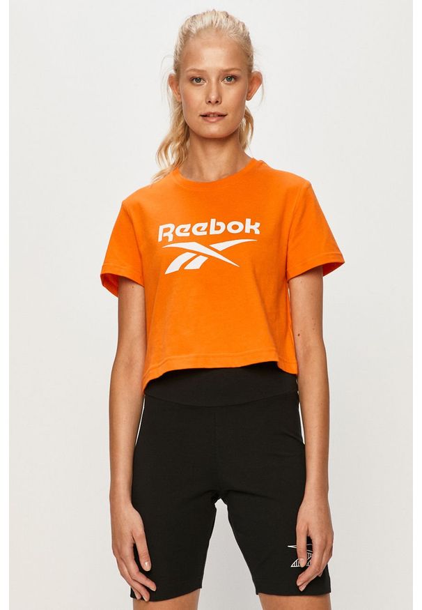 Reebok Classic - T-shirt. Kolor: pomarańczowy. Materiał: bawełna, materiał, dzianina, elastan. Wzór: nadruk. Styl: sportowy