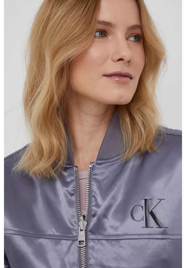 Calvin Klein Jeans Kurtka dwustronna damska kolor szary przejściowa. Okazja: na co dzień. Kolor: szary. Materiał: materiał, włókno. Wzór: gładki. Styl: casual