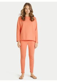 Pomarańczowe bawełniane spodnie dresowe Juvia. Kolor: pomarańczowy. Materiał: dresówka, bawełna #1