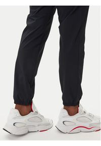 Under Armour Spodnie dresowe UA Vibe Woven 1386557 Czarny Regular Fit. Kolor: czarny. Materiał: syntetyk #5