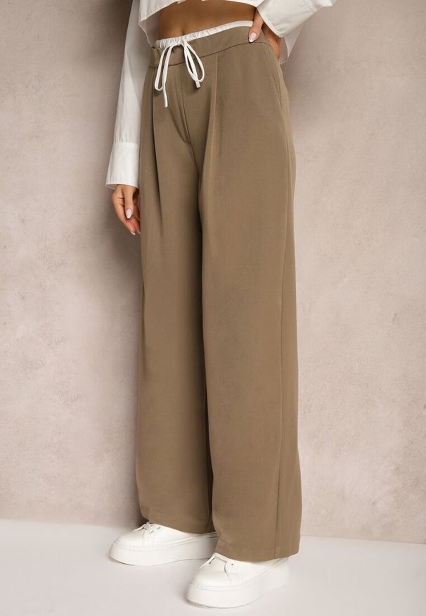 Renee - Brązowe Spodnie o Luźnym Fasonie z Suwakiem na Boku i Troczkiem w Pasie Irialea. Okazja: na co dzień. Kolor: brązowy. Materiał: wiskoza, tkanina. Styl: casual