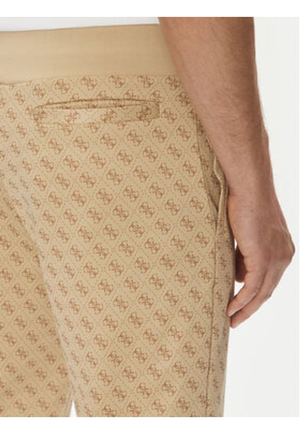 Guess Spodnie dresowe Korbin Z2BB05 FL04Q Beżowy Regular Fit. Kolor: beżowy. Materiał: bawełna, syntetyk