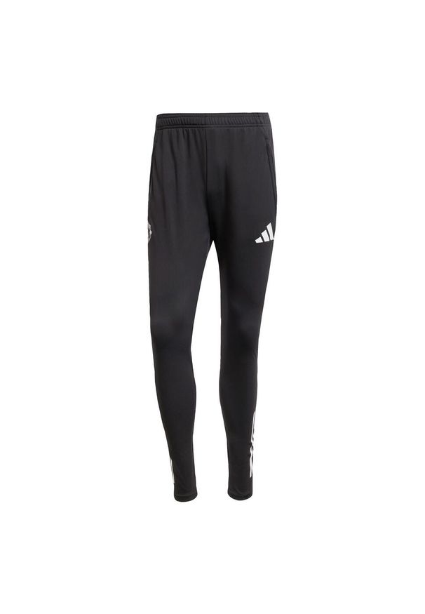 Adidas - Spodnie Manchester United Tiro 25 Competition Training. Kolor: fioletowy, wielokolorowy, czarny. Sport: piłka nożna