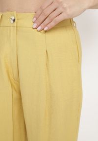 Born2be - Żółte Spodnie Długie Szerokie z Kieszeniami Palazzo Lisarana. Okazja: na co dzień. Kolor: żółty. Długość: długie. Styl: casual #4