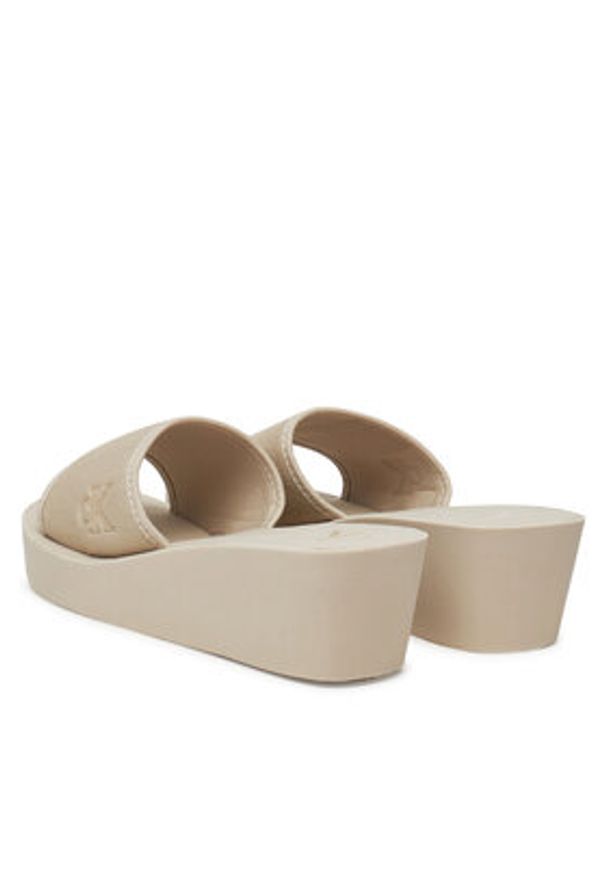 Calvin Klein Jeans Klapki Beach Wedge Slide Canvas YW0YW01725 Beżowy. Kolor: beżowy. Materiał: materiał