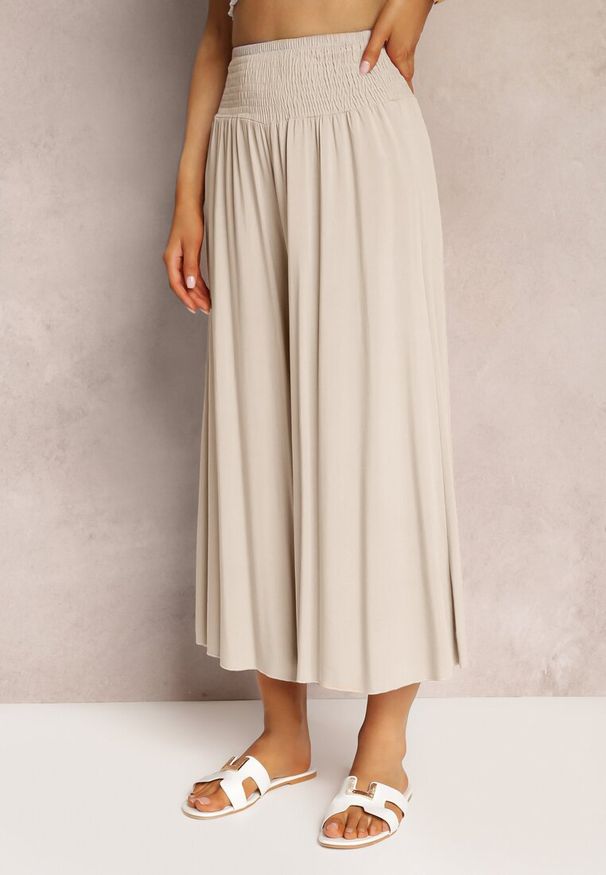 Renee - Jasnobeżowe Szerokie Spodnie High Waist o Długości 7/8 Rathi. Stan: podwyższony. Kolor: beżowy. Materiał: wiskoza, tkanina