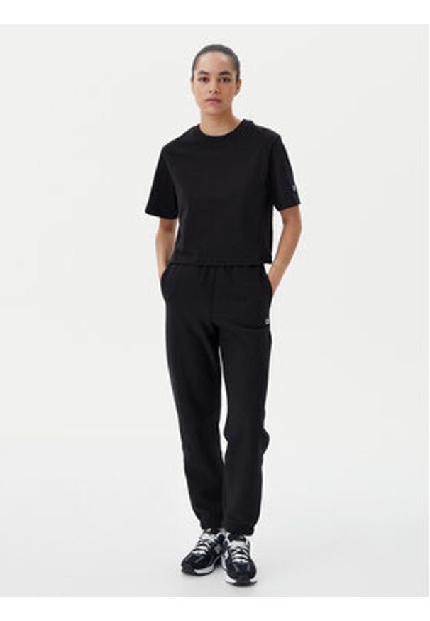 Champion Spodnie dresowe 117872 Czarny Slim Fit. Kolor: czarny. Materiał: bawełna