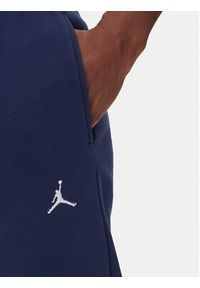 Nike Spodnie dresowe FV7277 410 Granatowy Regular Fit. Kolor: niebieski. Materiał: bawełna #4