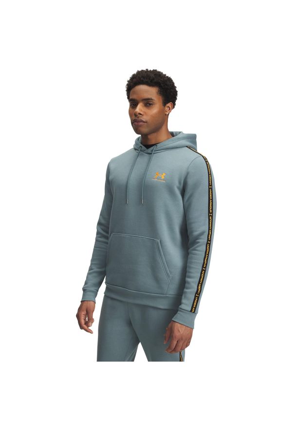 Bluza z kapturem z logo na paskach Under Armour Icon Fleece. Typ kołnierza: kaptur. Kolor: niebieski. Sport: fitness