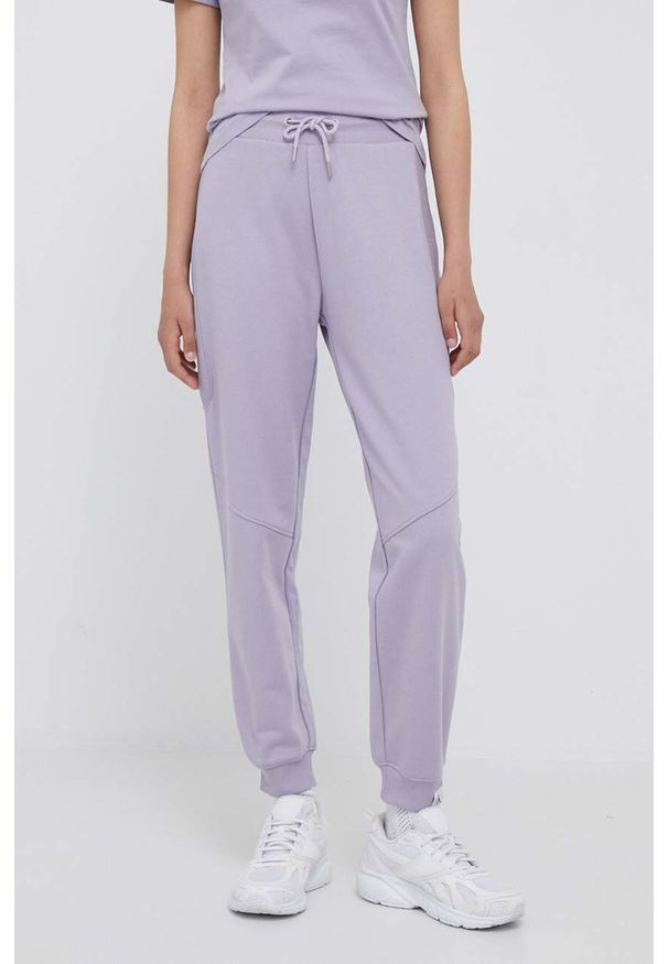 Calvin Klein Jeans spodnie dresowe kolor fioletowy gładkie. Kolor: fioletowy. Materiał: dresówka. Wzór: gładki