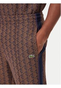 Lacoste Spodnie dresowe XH1440 Brązowy Regular Fit. Kolor: brązowy. Materiał: syntetyk
