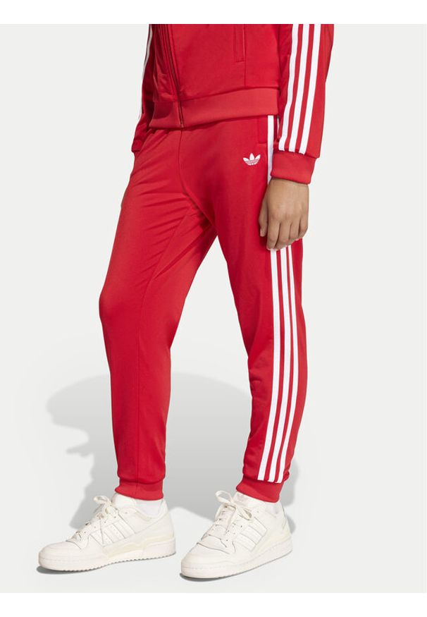 Adidas - adidas Spodnie dresowe adicolor SST KE2861 Czerwony Regular Fit. Kolor: czerwony. Materiał: syntetyk