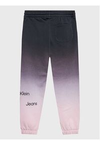 Calvin Klein Jeans Spodnie dresowe All Over Gradient IU0IU00332 Fioletowy Regular Fit. Kolor: fioletowy. Materiał: bawełna. Wzór: gradientowy