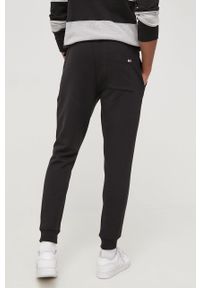 Tommy Jeans Spodnie męskie kolor czarny z aplikacją. Kolor: czarny. Materiał: włókno, materiał, dzianina. Wzór: aplikacja